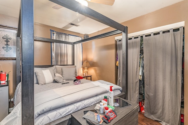 bedroom with dark hardwood / wood-style flooring