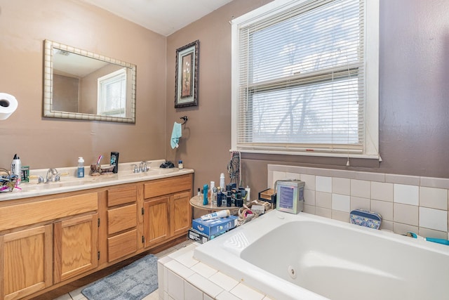 bathroom featuring vanity and a relaxing tiled tub