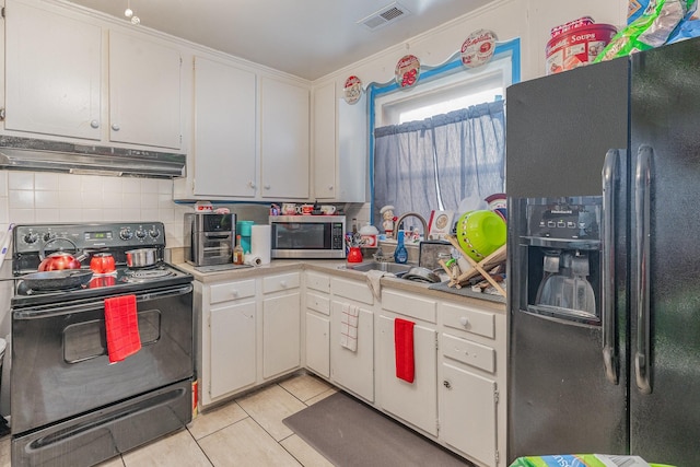 kitchen with white cabinets, sink, stainless steel appliances, and decorative backsplash