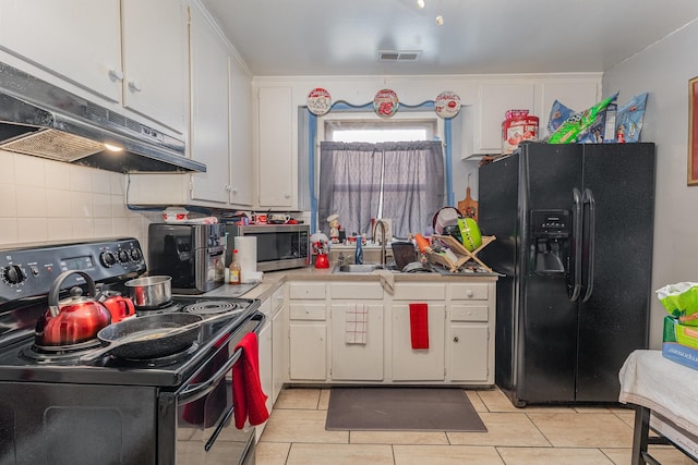 kitchen featuring black appliances, sink, tasteful backsplash, white cabinets, and light tile patterned flooring