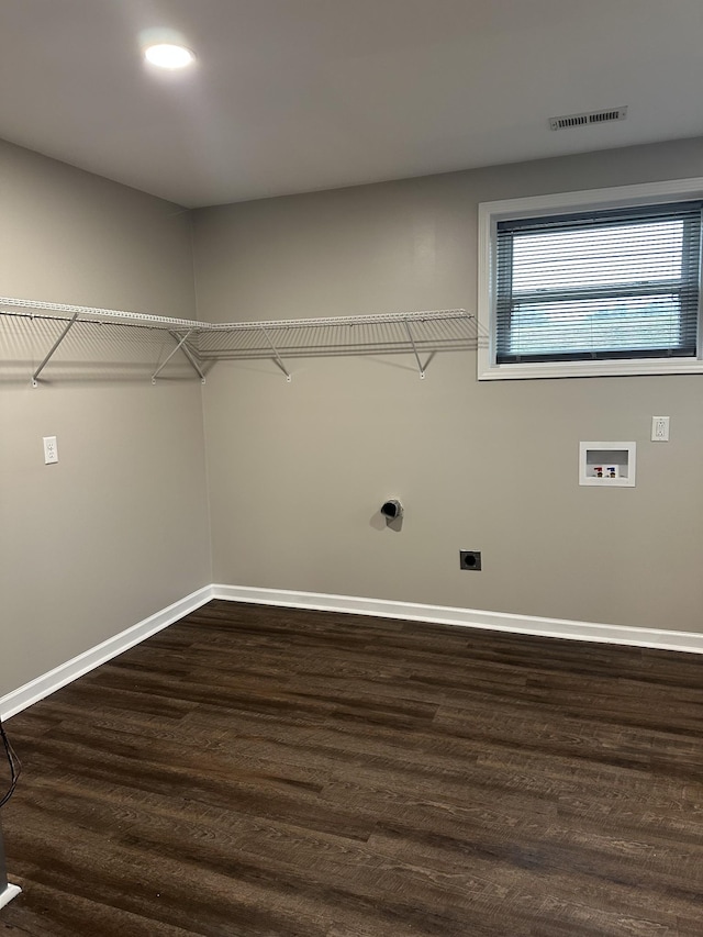 laundry area featuring dark wood-type flooring, hookup for an electric dryer, and hookup for a washing machine