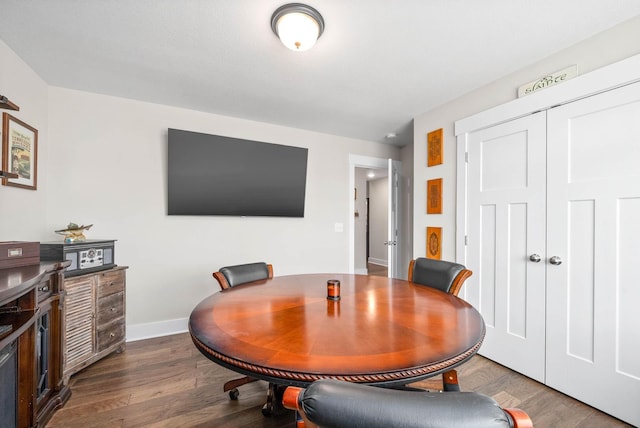 dining space featuring dark hardwood / wood-style flooring