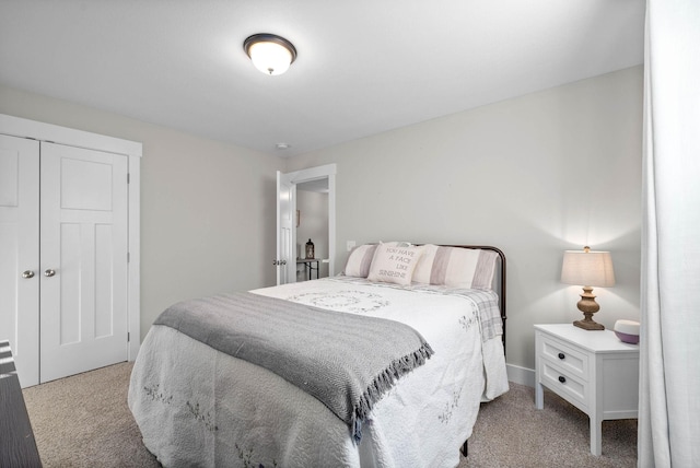 carpeted bedroom featuring a closet