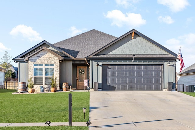 craftsman house with a garage, central air condition unit, and a front yard