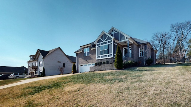 view of front of house featuring a garage and a front lawn