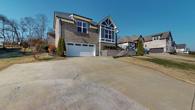 view of front of property featuring a garage and a front lawn