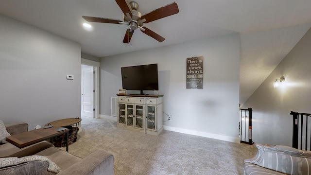 living room with ceiling fan and carpet flooring