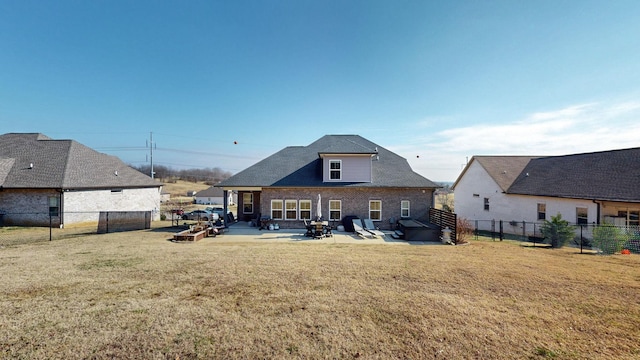 back of house featuring a yard and a patio area