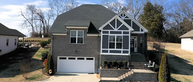 tudor house featuring a garage