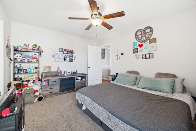 carpeted bedroom featuring ceiling fan