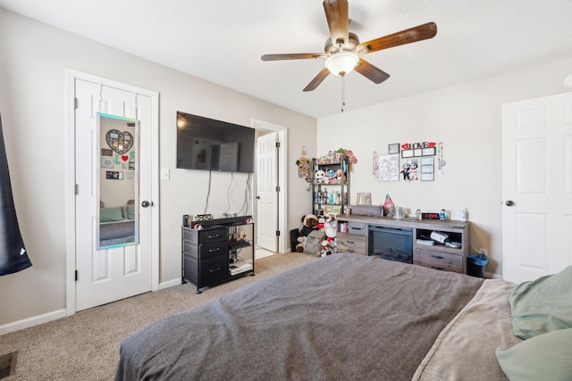 bedroom with ceiling fan and carpet flooring