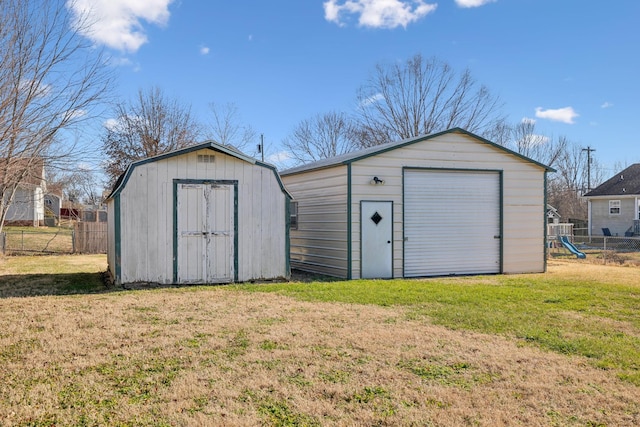 view of outbuilding with a playground and a lawn