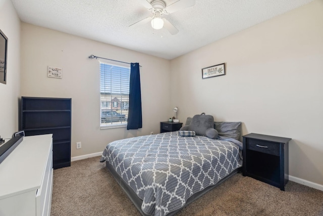 bedroom featuring a textured ceiling, ceiling fan, and carpet flooring