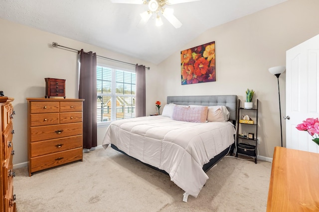 carpeted bedroom featuring ceiling fan and lofted ceiling