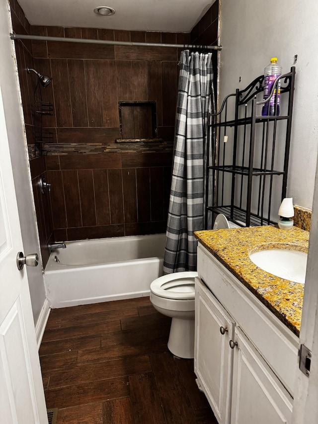 full bathroom featuring toilet, vanity, and shower / tub combo with curtain