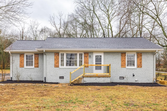 ranch-style home with a front lawn