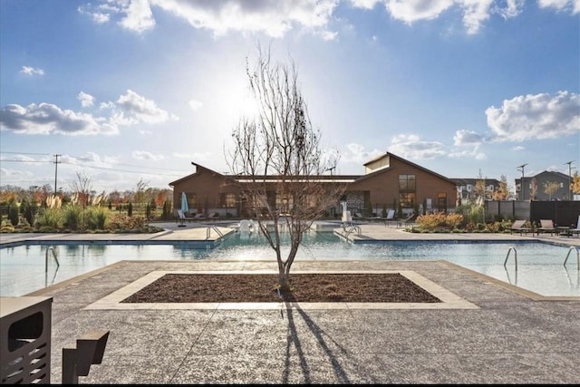 view of swimming pool featuring a patio