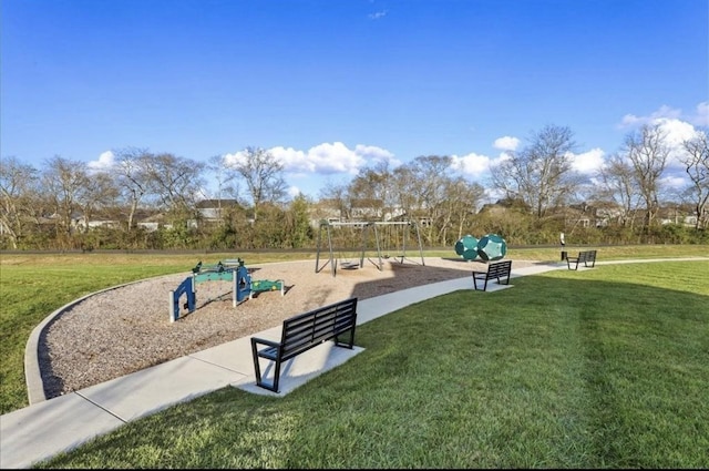 surrounding community featuring a playground and a lawn