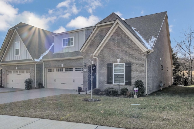 view of front facade with a front yard and a garage