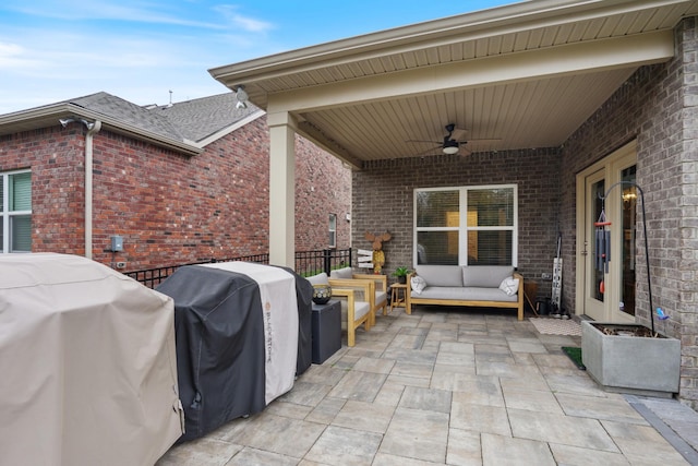 view of patio featuring ceiling fan, fence, a grill, and french doors