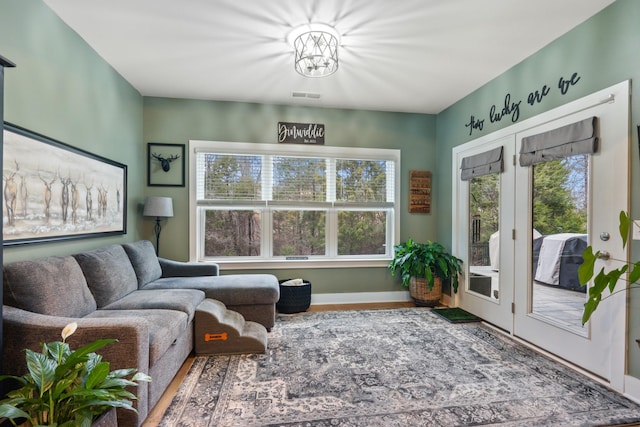 living area with visible vents and french doors