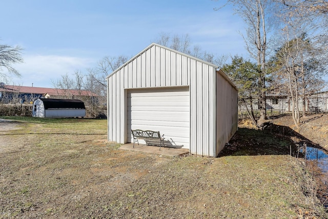 garage featuring a yard