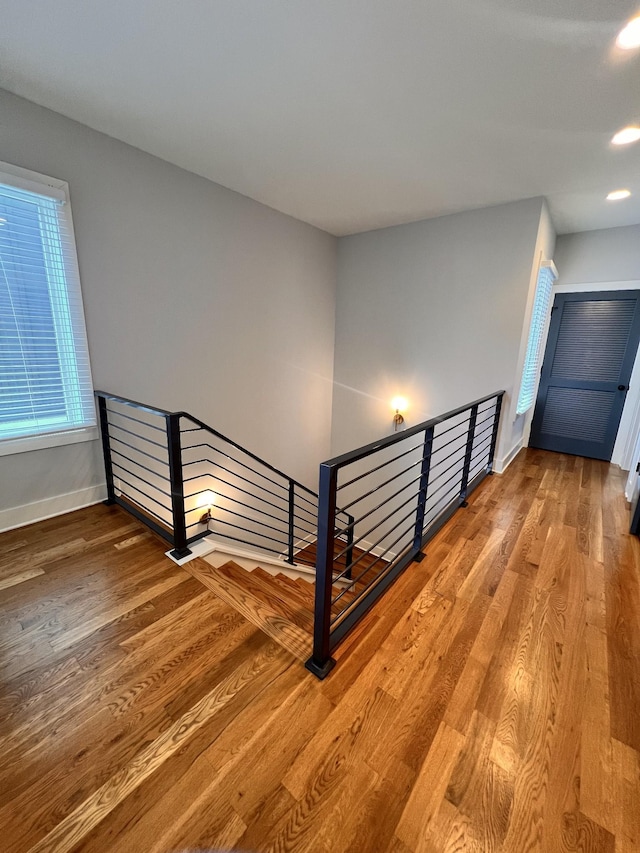 staircase featuring hardwood / wood-style flooring