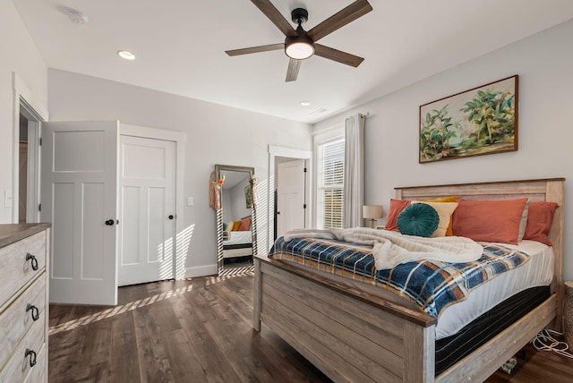 bedroom with ceiling fan and dark wood-type flooring