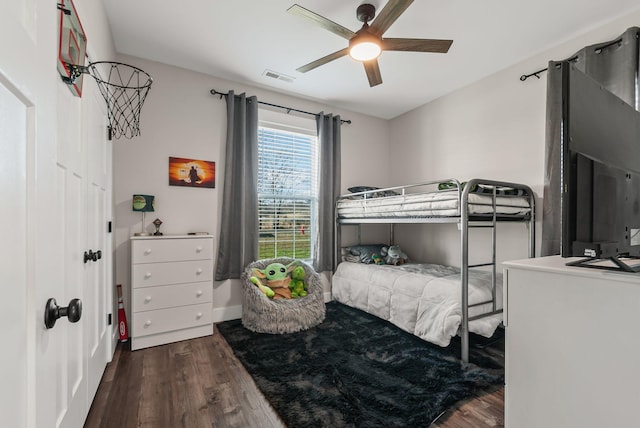 bedroom featuring dark wood-type flooring and ceiling fan