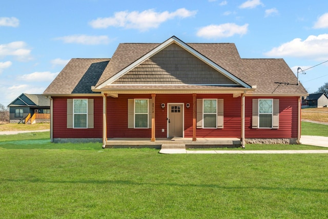 view of front of home featuring a front yard and a porch