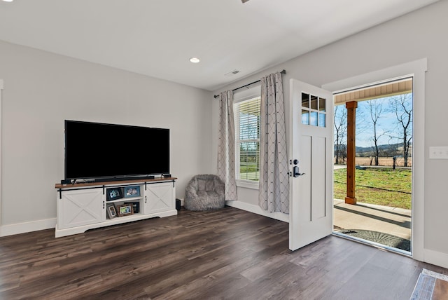 living room with dark hardwood / wood-style flooring