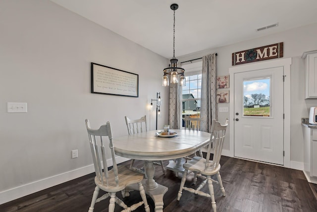 dining area with dark wood-type flooring