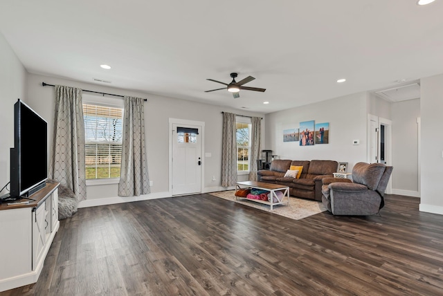 living room with ceiling fan and dark hardwood / wood-style floors