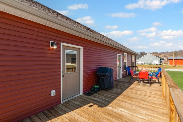 wooden deck featuring area for grilling