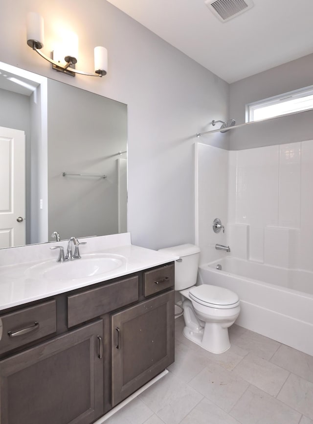 full bathroom featuring toilet, vanity, tile patterned floors, and  shower combination