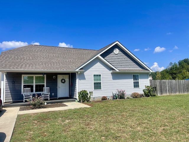 ranch-style house featuring a front yard and a porch