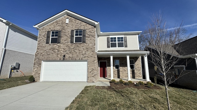 view of front facade featuring a porch, a garage, and a front lawn