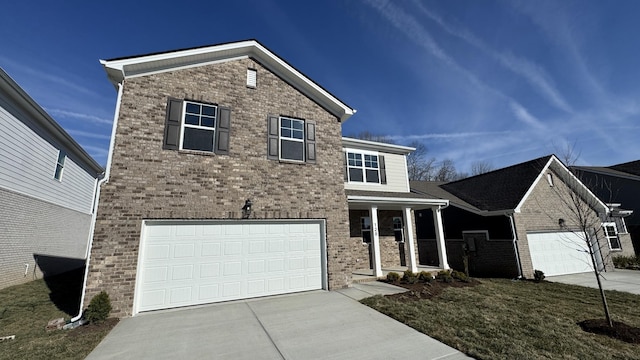 view of front of house featuring a garage, covered porch, and a front lawn