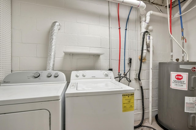 laundry area featuring washing machine and clothes dryer and electric water heater