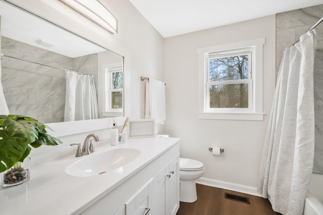 full bathroom featuring hardwood / wood-style flooring, toilet, vanity, and shower / tub combo with curtain