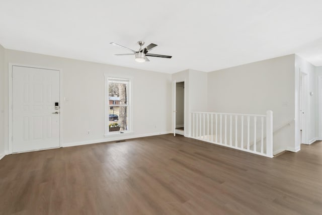 interior space featuring ceiling fan and dark hardwood / wood-style flooring