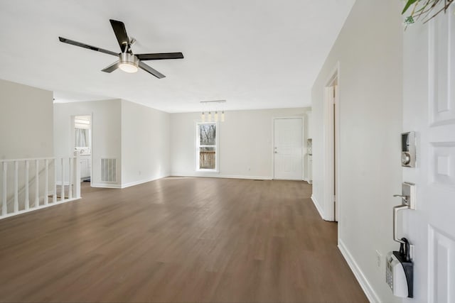 spare room with ceiling fan and dark hardwood / wood-style flooring