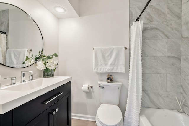 full bathroom featuring shower / bath combo with shower curtain, a textured ceiling, toilet, and vanity