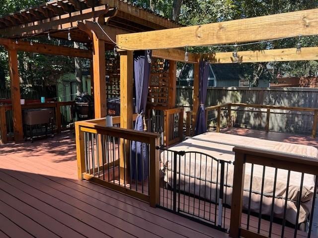 wooden deck featuring a pergola