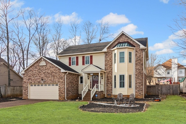 front of property with a garage and a front lawn