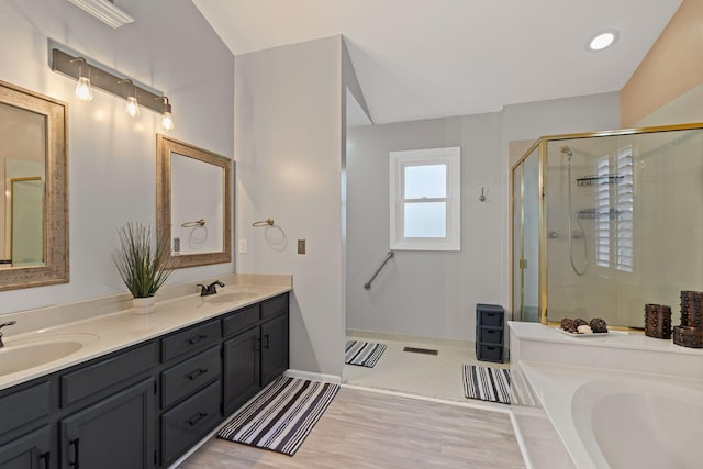 bathroom with an enclosed shower and vanity