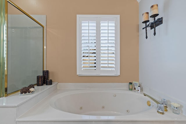 bathroom with tiled bath