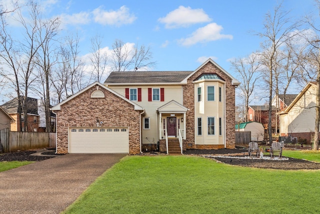 front of property featuring a garage and a front yard