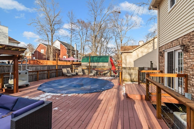 wooden terrace with an outdoor hangout area