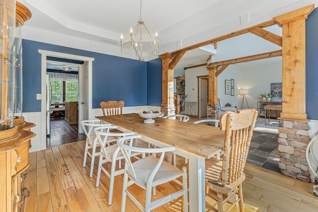 dining room featuring a chandelier and light hardwood / wood-style flooring